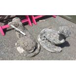 A pair of concrete dachshund pattern garden ornaments