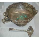A 33cm diameter silver plated copper punch bowl with embossed floral swag decoration, six hook