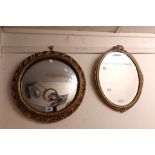 A vintage gilt plaster framed convex wall mirror with decorative pierced border - sold with