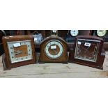 Three vintage oak cased mantel clocks comprising one chiming and two striking