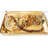 A case containing a marked 925 and reconstituted amber cabochon panel bracelet and costume