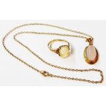 A 375 (9ct.) gold and rose quartz oval pendant on marked 9c neck chain - sold with a 9ct. gold cameo