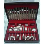 A vintage polished wood canteen containing a six place setting of Cooper Brothers silver plated