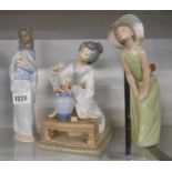 A Lladro porcelain figurine depicting a Japanese lady flower arranging and a similar depicting a