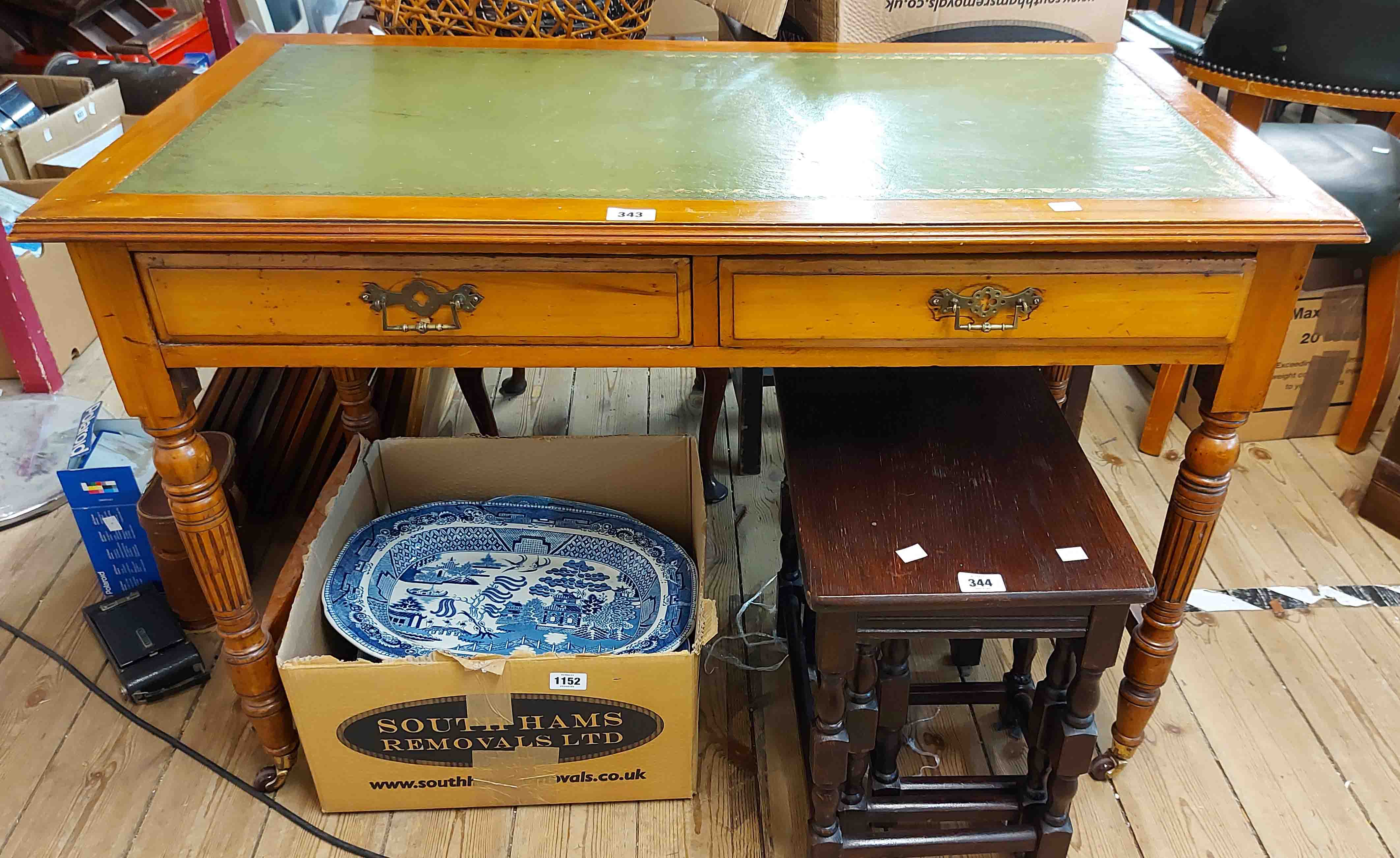 A 1.07m Edwardian satin walnut writing desk with green leather inset top and two frieze drawers, set