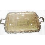 A 51cm Victorian silver plated serving tray with flanking cast handles, engraved decoration and