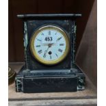 A late Victorian black slate and marble cased mantel timepiece with eight day movement