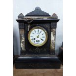 A late Victorian black slate and marble cased mantel clock with incised gilded decoration and