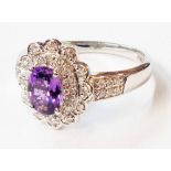 A 750 (18ct.) white gold Iliana vintage style ring, set with central oval alexandrite within a