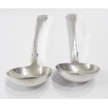 Two matching antique Scottish silver kings pattern sauce ladles with engraved initials to