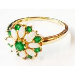 A 375 (9ct.) gold ring, set with marquise shaped opals and bright green stones - size P 1/2