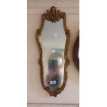 A small vintage Aisonea ornate gilt framed wall mirror with Rococo border and shaped plate