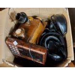 A box containing a quantity of vintage telephones and other electrical equipment including wall