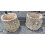 A pair of Sandford Stone concrete planters of tree trunk form