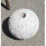 A small granite ornament of orb form