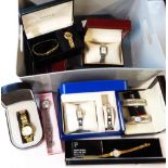 A crate containing a quantity of assorted ladies' wristwatches and dress sets including Rotary,