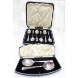A cased set of six silver teaspoons - London, 1921 - sold with a fan cased pair of silver spoons