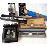 A box containing a collection of promotional branded gentlemen's wristwatches comprising