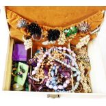 A jewellery box with costume jewellery contents