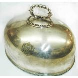 A silver plated oval meat dome with engraved family armourial and beaded borders