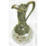 A 19th Century hobnail cut glass claret jug with ornate silver plated (back to nickel) mount with