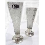 Two similar hobnail cut glass bud vases of tapering form, set on loaded silver circular bases -