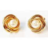 A pair of 375 (9ct.) gold earrings, each set with central cultured pearl studded with a tiny diamond