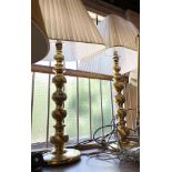 A pair of large modern brass table lamps of column form - sold with shades