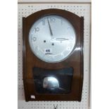 A vintage Keinzle polished walnut cased wall clock with visible pendulum and eight day chiming