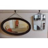 A small vintage frameless belleved wall mirror - sold with a 1920's bevelled oval wall mirror with