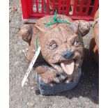 A small painted concrete figure depicting a mythical creature