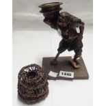 A Japanese Meiji period bronze figural candlestick depicting a sailor with later adapted replacement