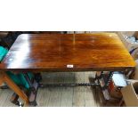 A 91cm late Victorian rosewood side table, set on twin flanking bobbin turned supports and