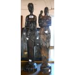 Two large carved wood Ghanaian African figures, each depicting a mother holding a child - signed C.