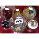 Six glass paperweights with controlled bubble and internal enamel decoration