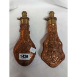 Two brass mounted copper powder flasks, each with embossed Rococo scrolling decoration