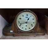 An early 20th Century ornate oak cased mantel clock with 1924 presentation plaque to front and