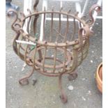 A 59cm high antique wrought iron pedestal planter of bulbous form, set on scroll feet