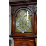A 19th Century figured walnut and strung longcase clock with blind fretwork decoration to hood,