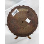 A 1920's brass 75 year calendar of easel form, covering dates from 1926-2000, with swivel disc to