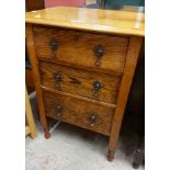 A 61cm 20th Century oak chest of three drawers set on ring turned legs