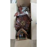 A modern stained wood cased German cuckoo wall clock - complete with paperwork - sold with a