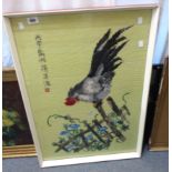 A Japanese embroidery picture depicting a rooster on an overgrown fence