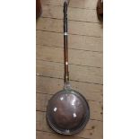 A 19th Century copper warming pan