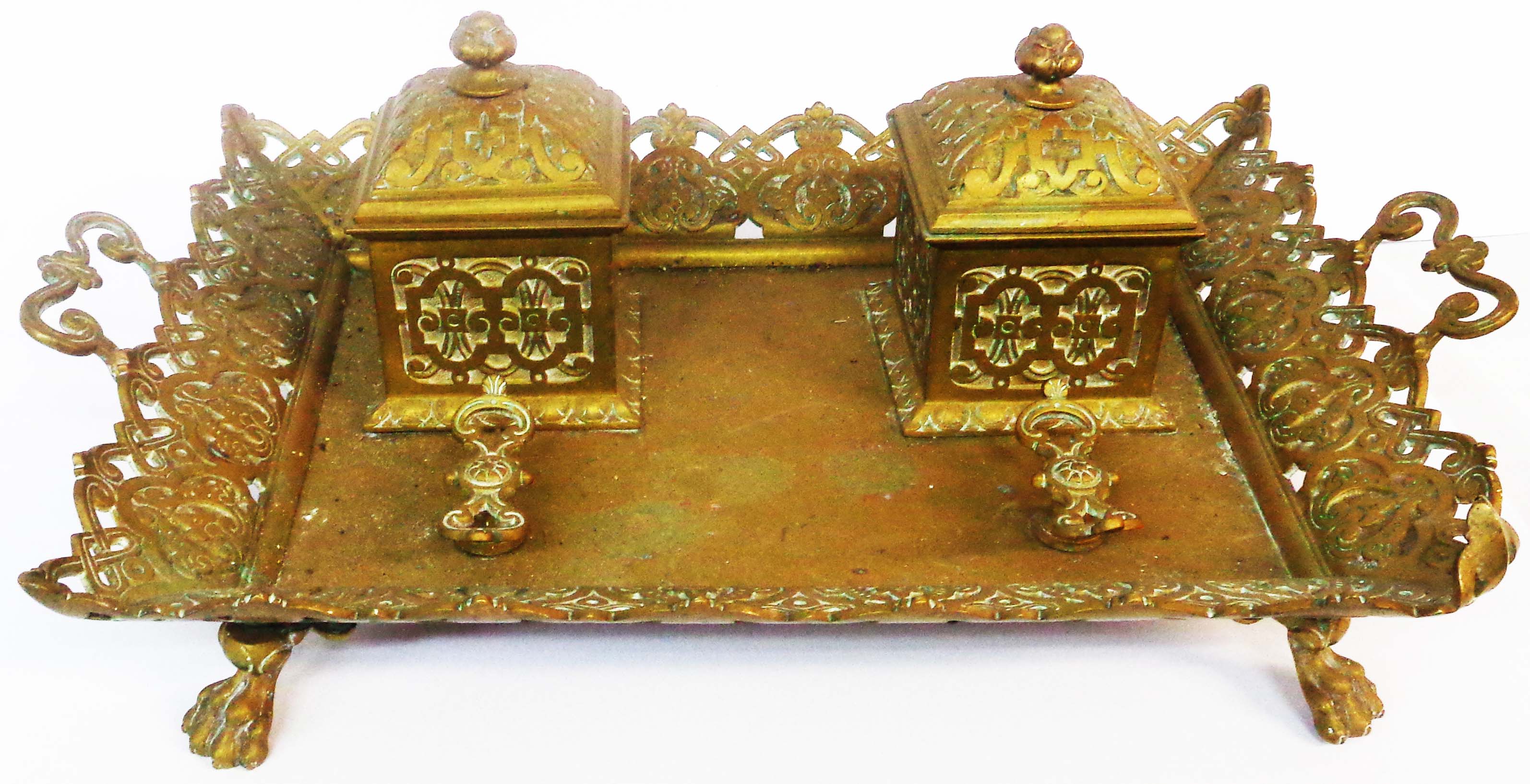 A late 19th Century cast brass inkstand, with lift-top inkwells and pen stand, on brass tray with