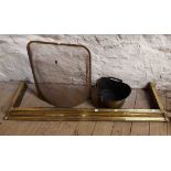 A brass coal bucket - sold with a brass fire fender and mesh fireguard - various condition