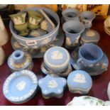A large quantity of Wedgwood blue Jasperware including trinket boxes, vases, candlesticks, table