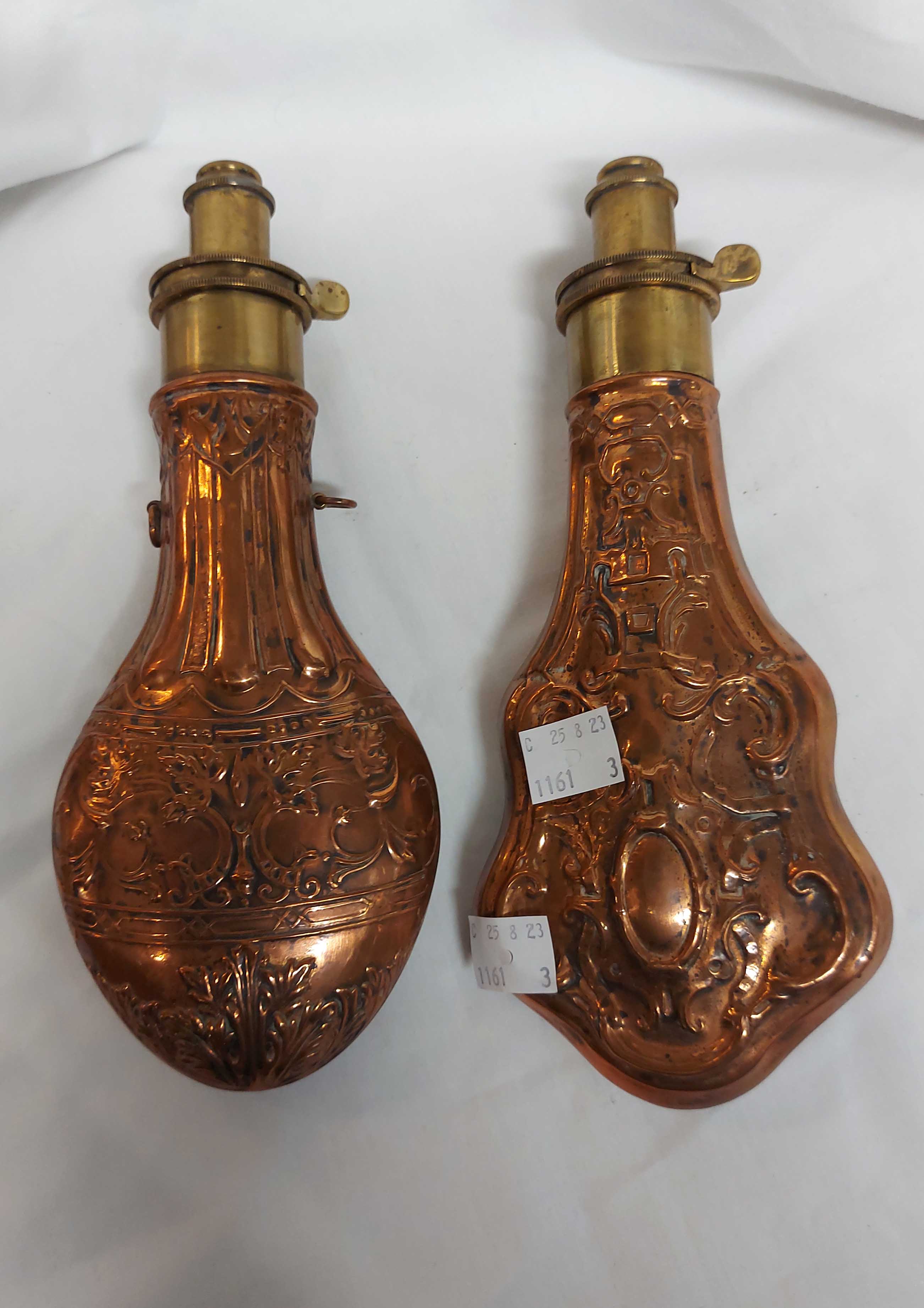 Two brass mounted copper powder flasks, each with embossed Rococo scrolling decoration - Image 3 of 3