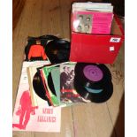 A box containing a selection of EP and other records including Shirley Bassey, Uncle Mac's Nursery