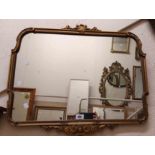 A vintage Aisonea ornate gilt framed wall mirror with shaped oblong plate and border